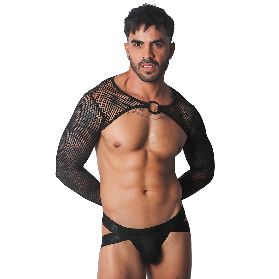 Black mesh bolero harness with long sleeves and a center O-ring, worn over a branded elastic jockstrap.