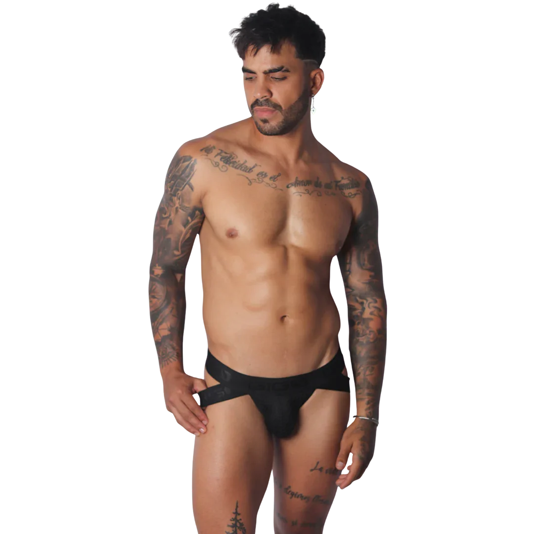 Black Gigo jockstrap featuring a wide branded elastic waistband and cutout side details on a tattooed male model.