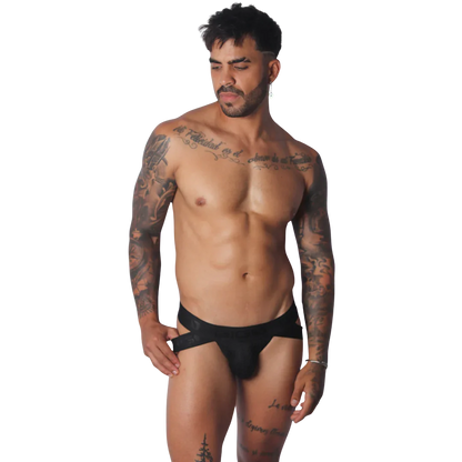 Black Gigo jockstrap featuring a wide branded elastic waistband and cutout side details on a tattooed male model.