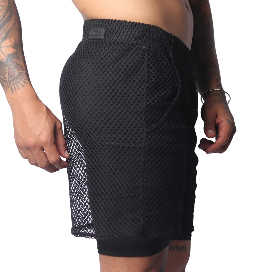 Black athletic shorts in a large-grid fishnet material with a solid inner layer and a branded elastic waistband.