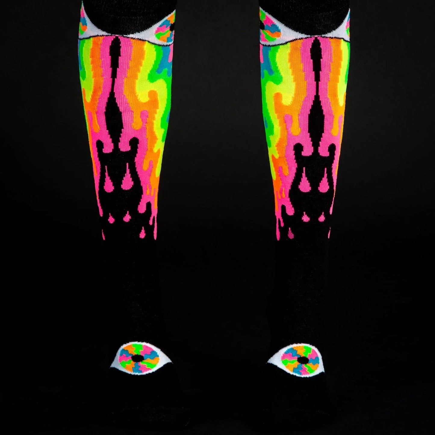 Psychedelic eye knee high socks featuring neon flame patterns with black silhouettes and eye motifs at the toes