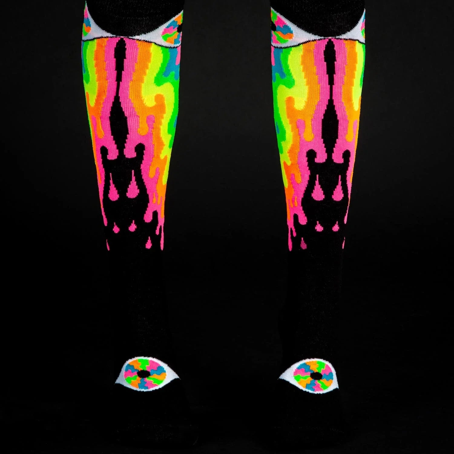 Psychedelic eye knee high socks featuring neon flame patterns with black silhouettes and eye motifs at the toes