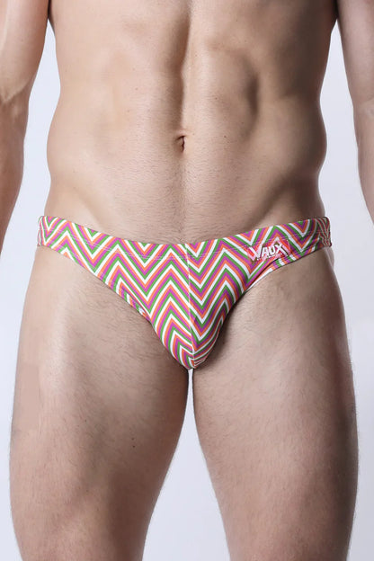 V-box pulse swim brief men’s swim trunks with vibrant pink green and white zigzag pattern for active swimwear