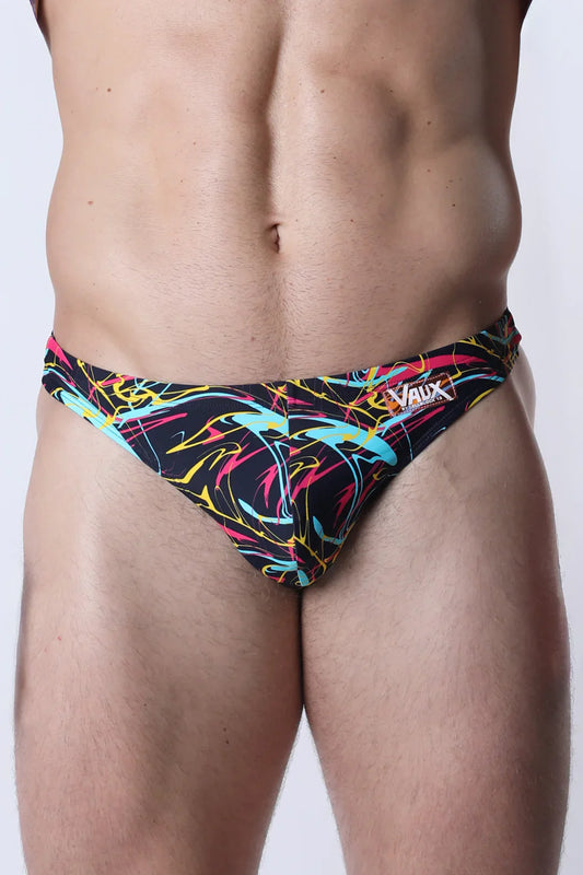Vaux pulse swim thong in neon pink yellow and cyan abstract pattern on black fabric for men