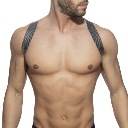 Black mesh shoulder straps with subtle grid pattern on the pushpin spider harness back side