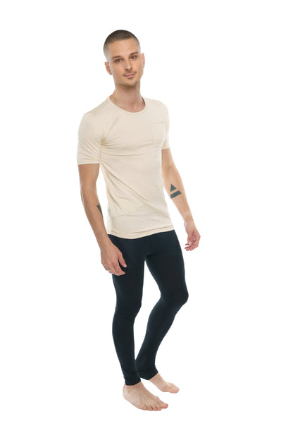 A man wearing a sand beige perfect pocket crew-neck tee with short sleeves and black leggings
