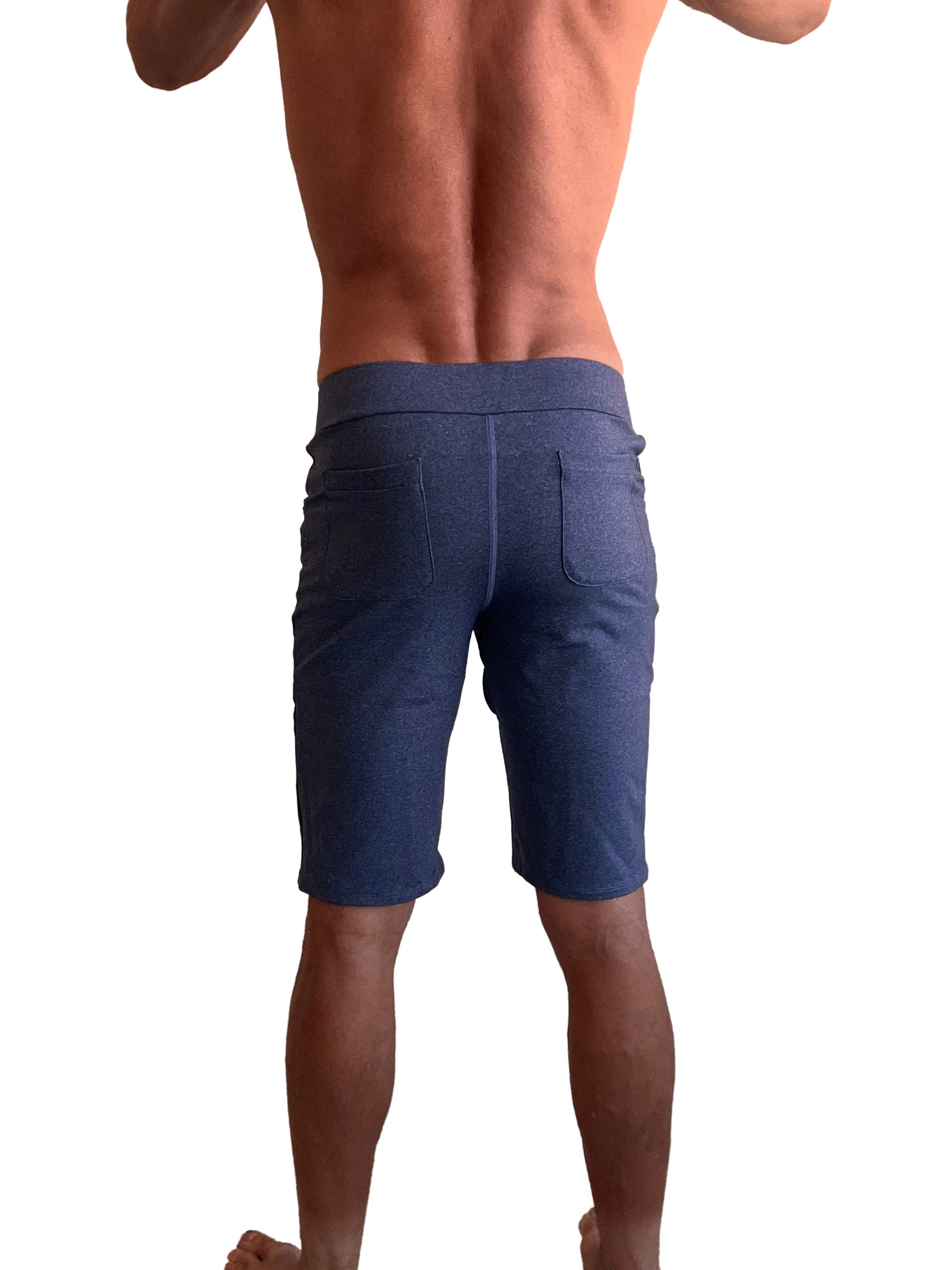 Back view of performance premium urban tactical dress shorts in navy blue heather denim with elastic waistband and two pockets