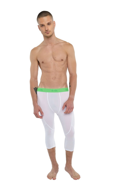 White capri-length performance yoga leggings in arctic white with bright green elastic waistband for compression support