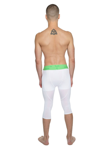 White capri-length performance yoga leggings in arctic white with a bright green elastic waistband for comfort