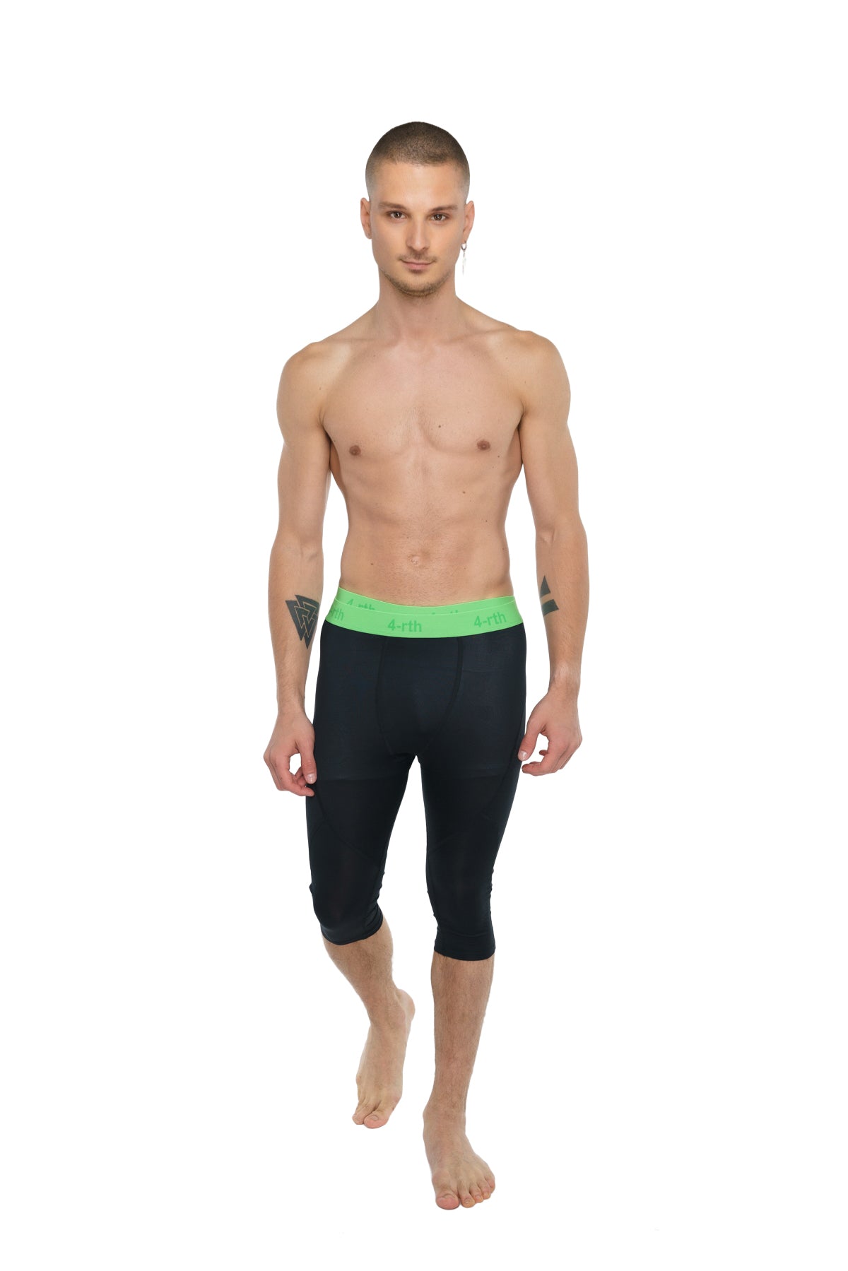Black capri-length performance yoga leggings with bright green elastic waistband for active wear