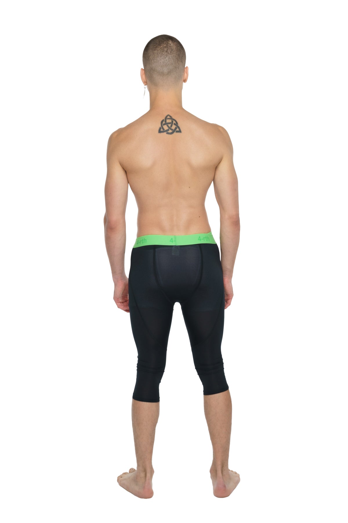 Performance yoga leggings 3/4 in carbon black with bright green waistband designed for compression and flexibility
