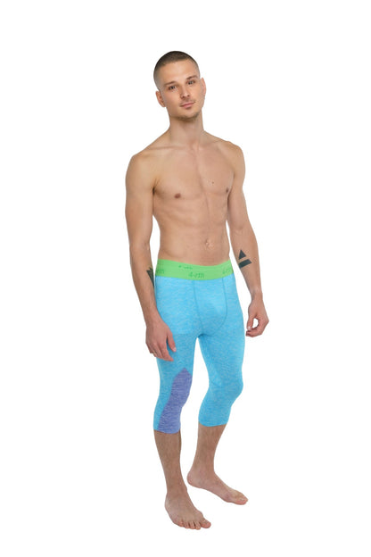 Performance yoga leggings 3/4 in light blue with vibrant green waistband and purple gradient detail on left thigh