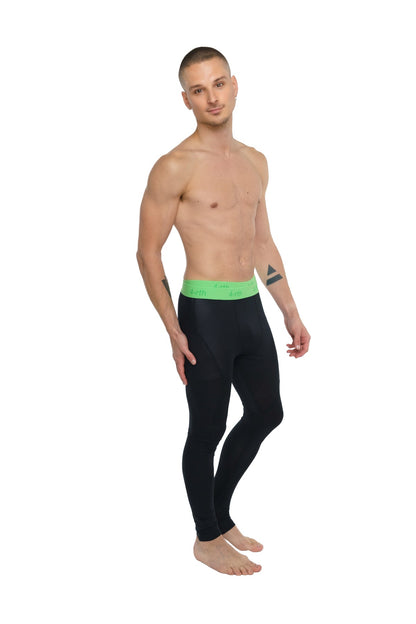 Black performance yoga leggings with a bright green calvin klein waistband in carbon black color