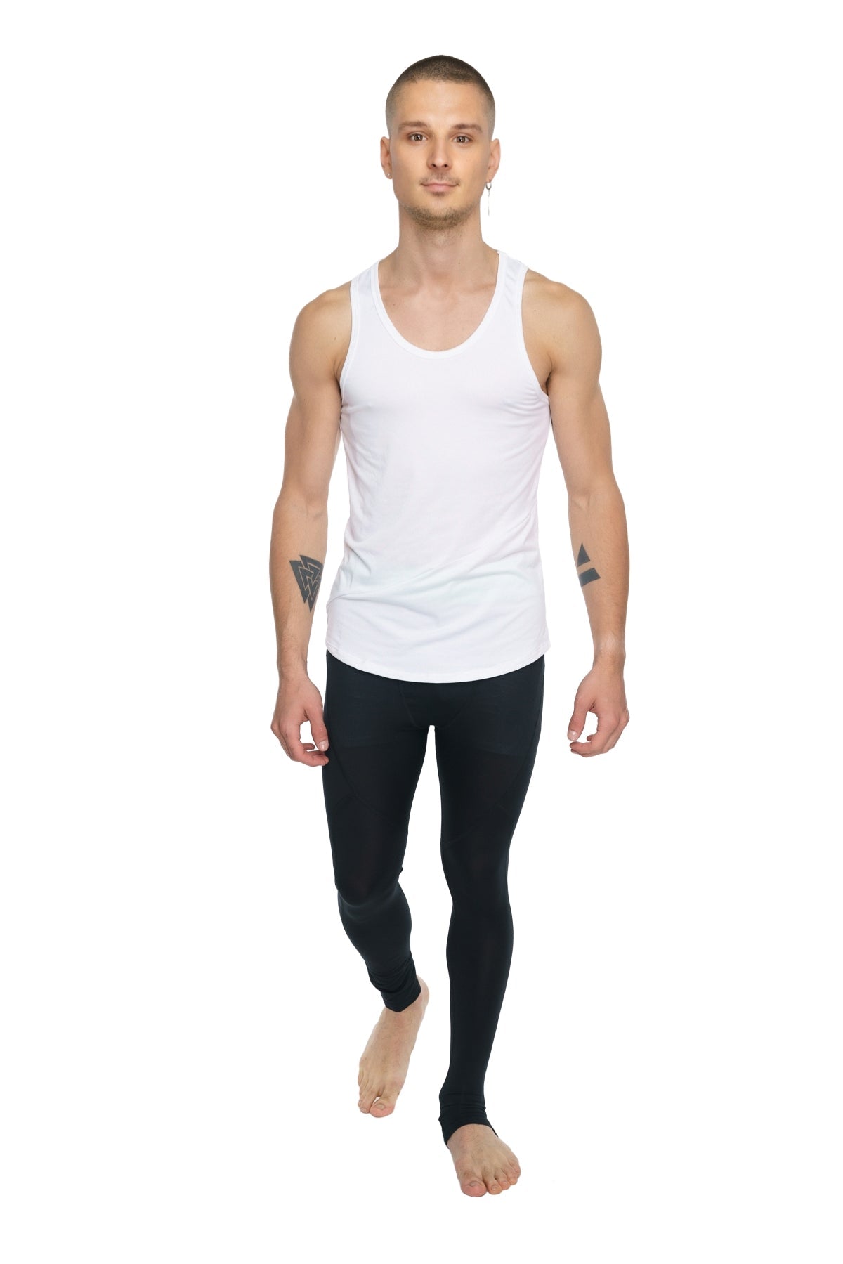 White sleeveless tank top with a simple fitted design paired with carbon black performance yoga leggings long