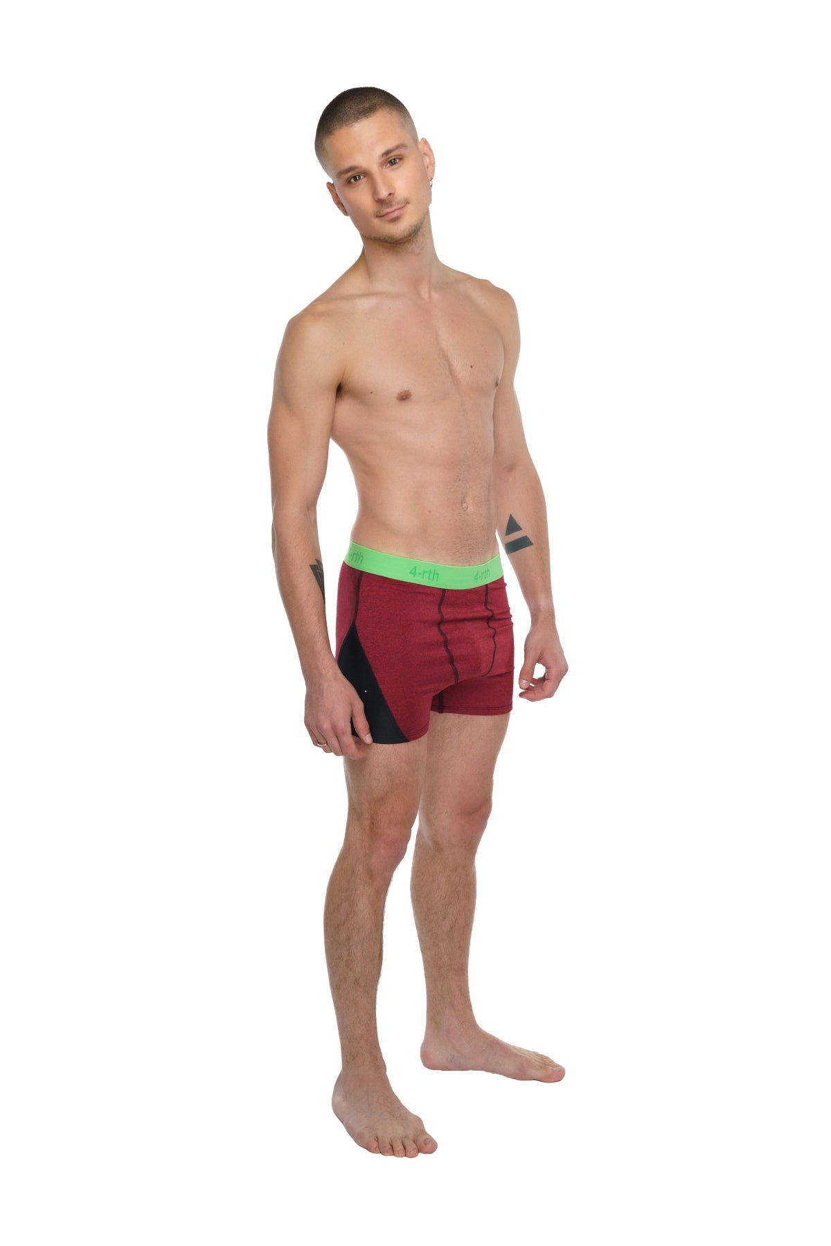 Performance yoga leggings short in brick red heather with maroon and black briefs and bright green waistband visible