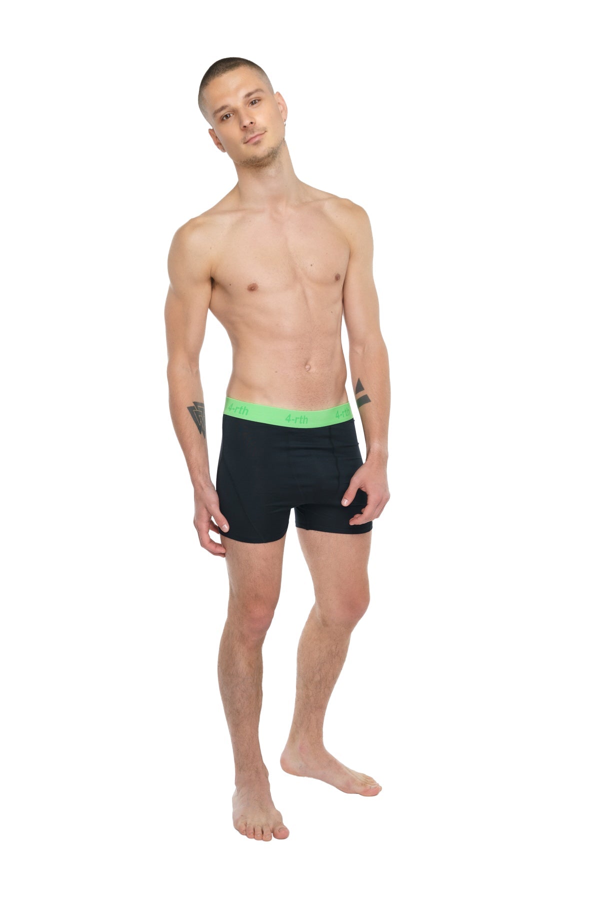 Performance yoga leggings short in carbon black with black boxer briefs and neon green waistband visible from the back