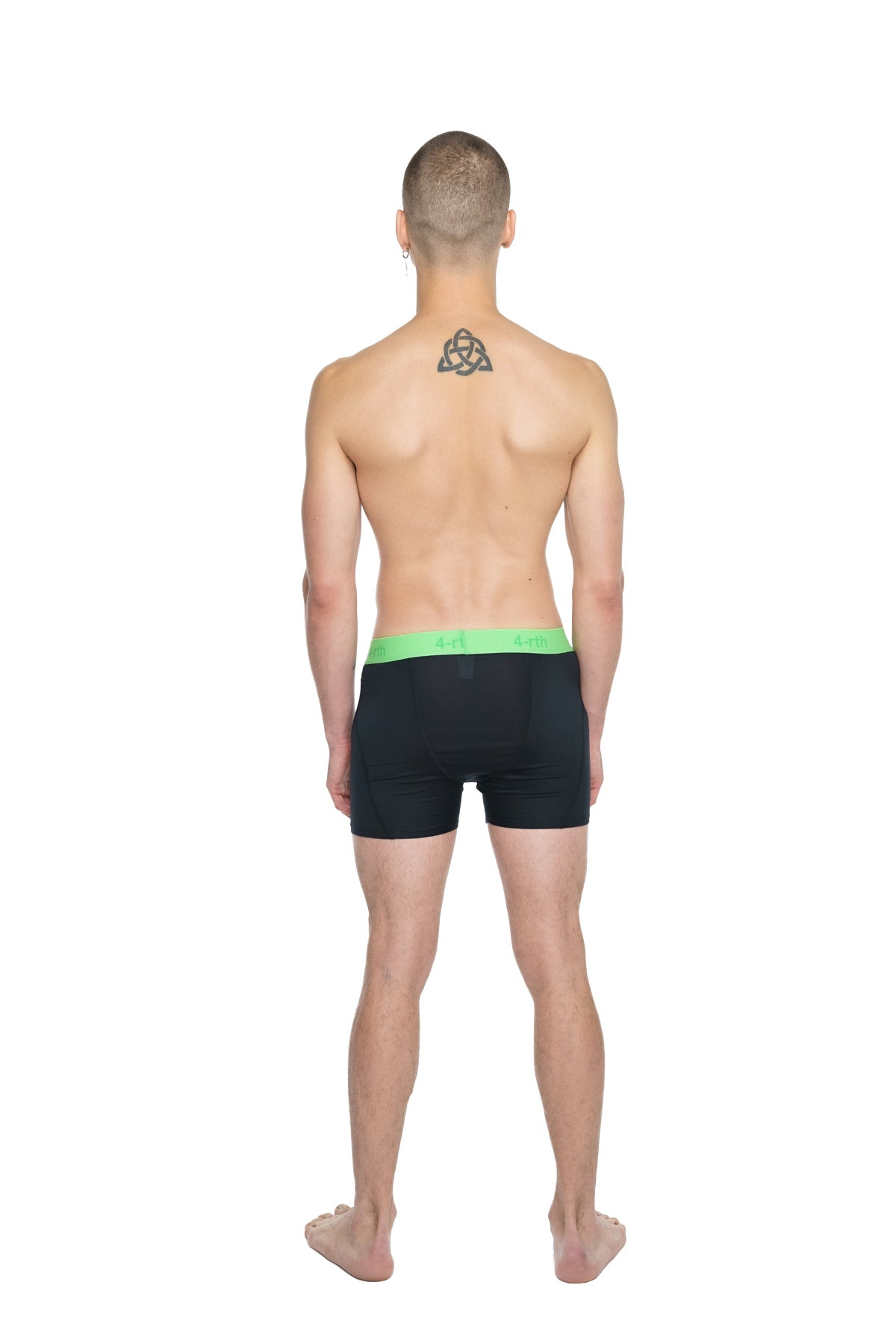 Black performance yoga leggings short in carbon black with bright green elastic waistband for active wear