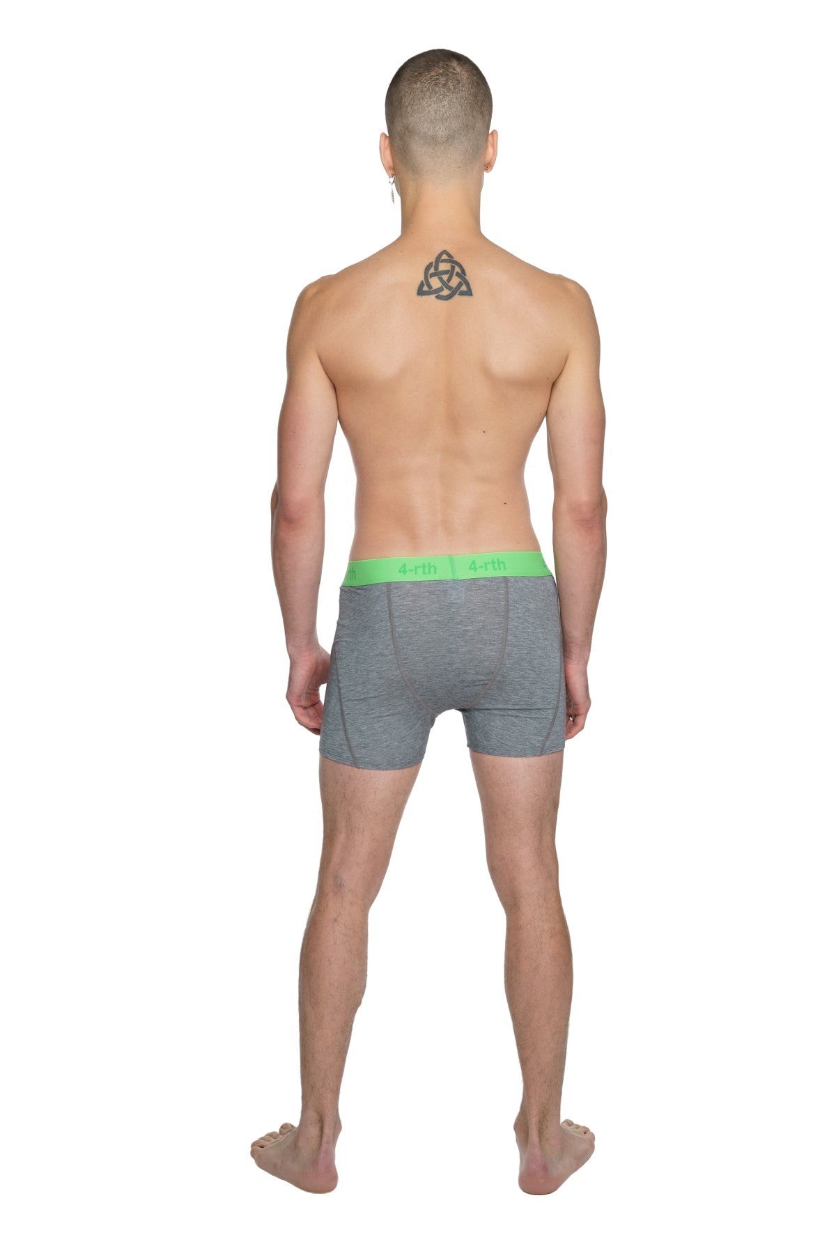 Gray boxer briefs with bright green waistband and a.p.c. branding paired with steel heather performance yoga leggings short