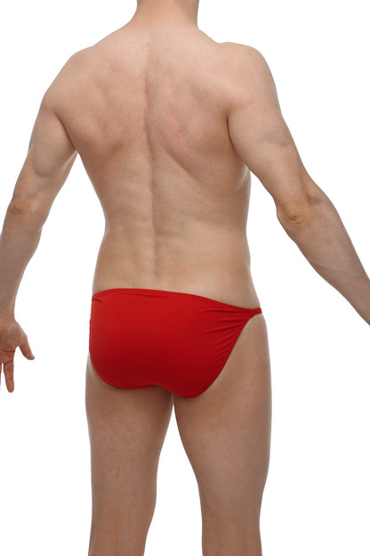 Red form-fitting swim trunks with smooth fabric finish from petitq bikini lhery red collection