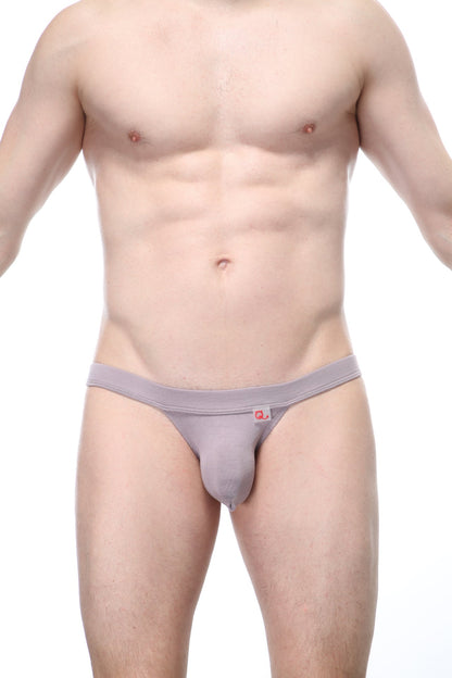 Gray men’s thong with a small red logo on the waistband from PetitQ Bikini Sillas organic bamboo peanut collection