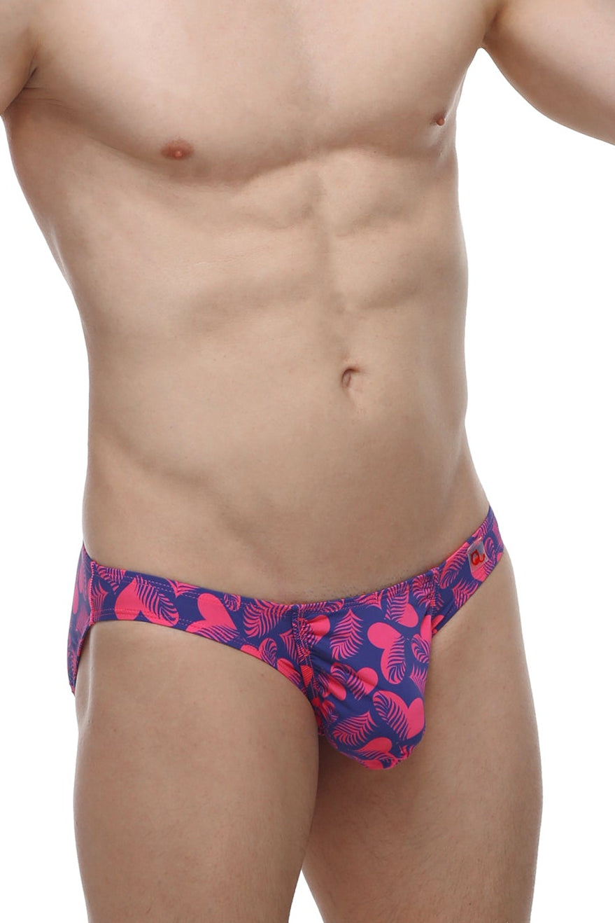 Vibrant pink and navy blue petitq bikini taik tropical hearts briefs with bold tropical leaf pattern