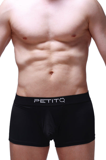Black petitq boxer hang briefs with smooth form-fitting design and white logo on waistband