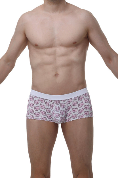 White briefs with a repeating pattern of pink cartoon pig faces from petitq boxer meljac piggy love collection