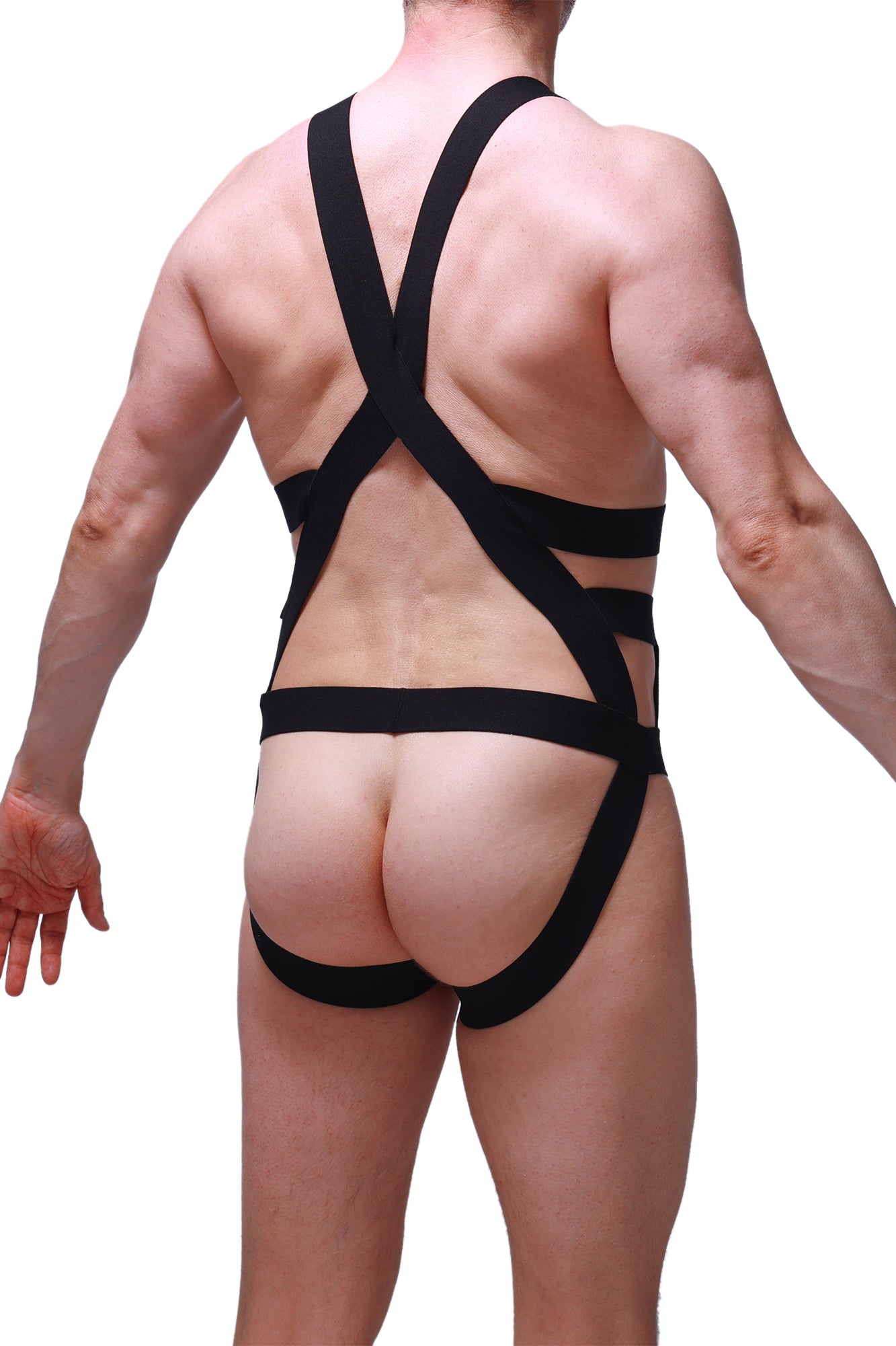 Back view of petitq jock harness champol black form-fitting bodysuit with crisscross straps and cutout design