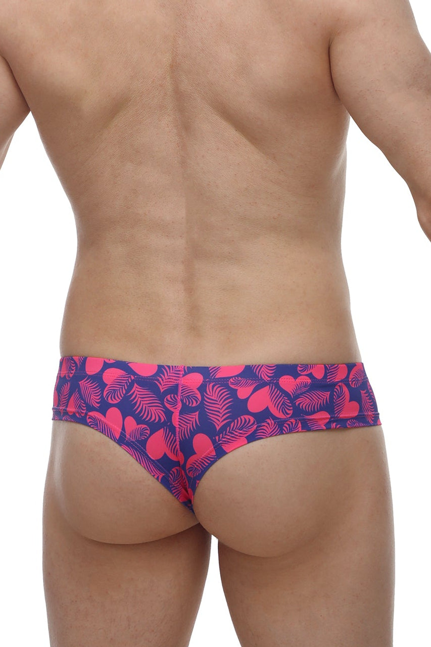 Petitq mini boxer tropical hearts swim trunks in vibrant pink and navy blue with a tropical leaf pattern