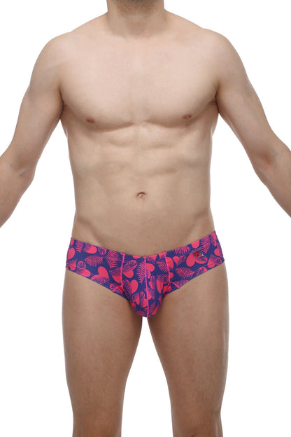 Vibrant pink and navy blue petitq mini boxer tropical hearts swim trunks with tropical leaf pattern for beachwear