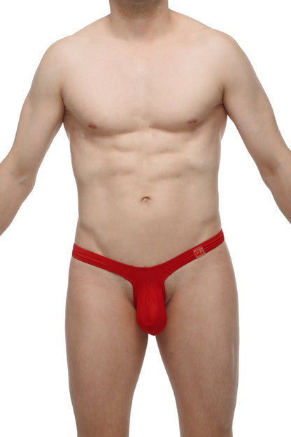 Red PetitQ thong made of smooth stretchy fabric with a small rectangular logo on the waistband front side