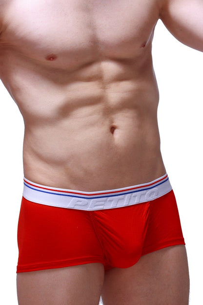 Red petitbjörn boxer briefs with white elastic waistband with red and blue stripes made from modal fabric