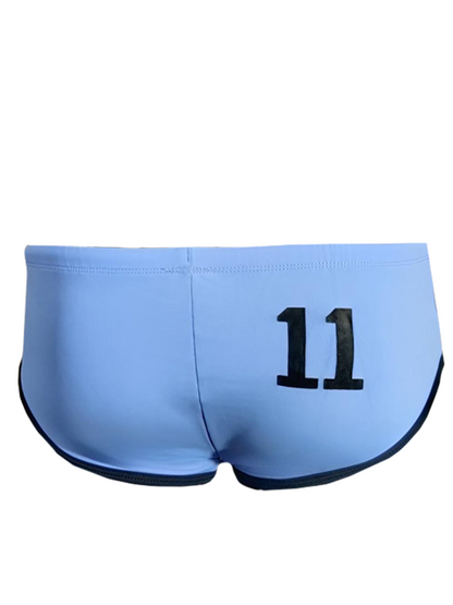 Light blue pride jethro 11 swim racer trunks with black trim and bold 11 printed on the back side