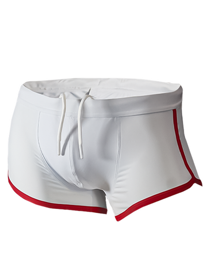 White pride vince trunk swim trunks with red trim and drawstring waistband for beach and pool use