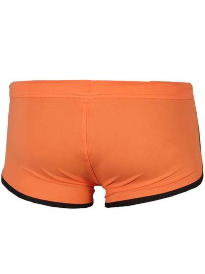 Bright orange pride vince trunk swim trunks with black trim along waistband and leg openings