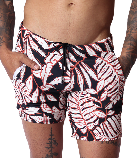 Front view of Gigo Prisma black beachwear shorts with red and white leaf print and adjustable drawstring waist.
