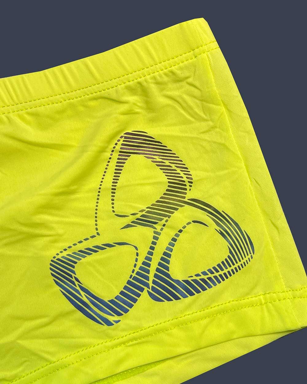 Bright neon yellow Private Structure BRUT4390 bare hipster shorts with bold blue and black three-ring logo