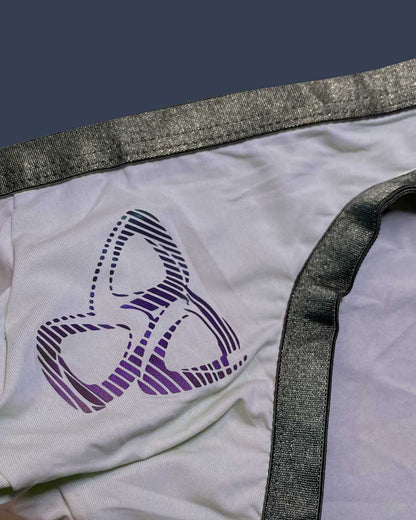 White fabric bare bikini underwear lilac with purple black striped abstract logo and shiny gray elastic waistband trim