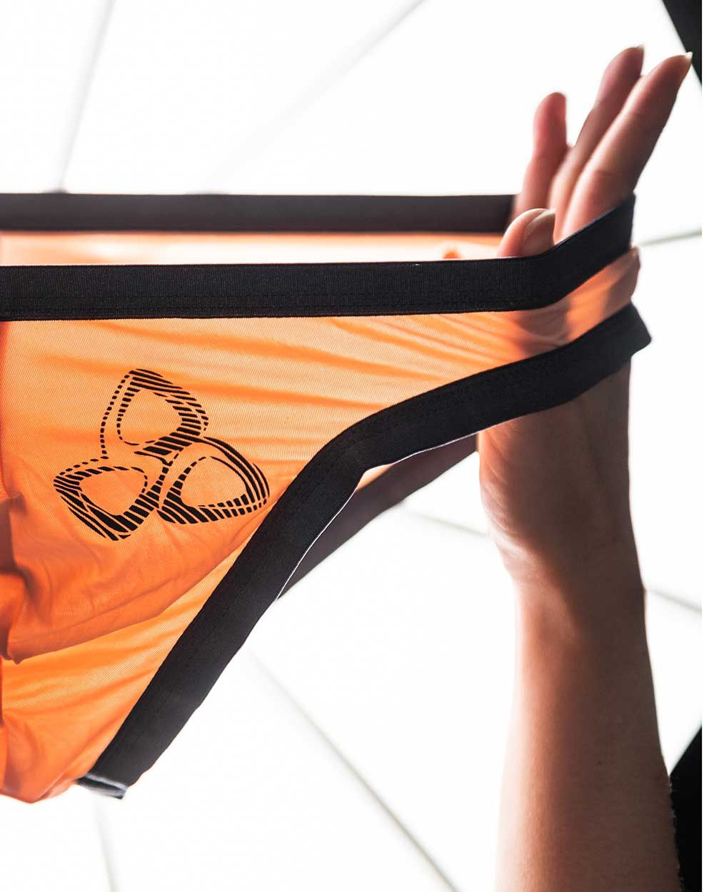 Orange mesh bikini bottom with black elastic trim and stylized logo on the front from Private Structure BRUT4393 Bare Bikini