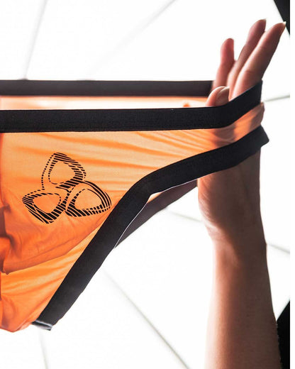 Orange mesh bikini bottom with black elastic trim and stylized logo on the front from Private Structure BRUT4393 Bare Bikini