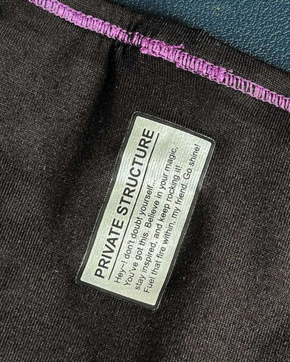 Black private structure prime eutopia bikini brief with purple stitched hem and silver label in charcoal color