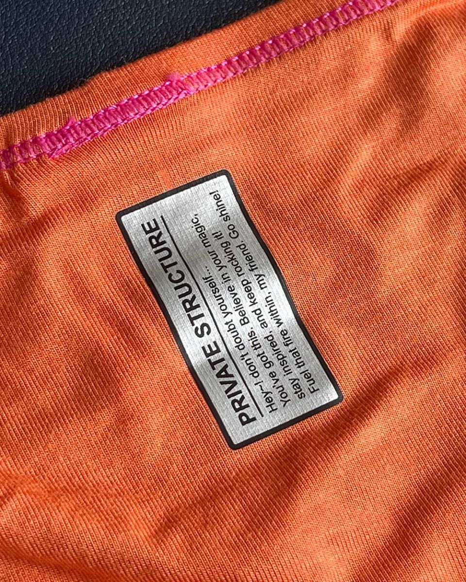 Orange tangarine private structure epus4563 prime eutopia bikini brief with black and silver label stitched along seam