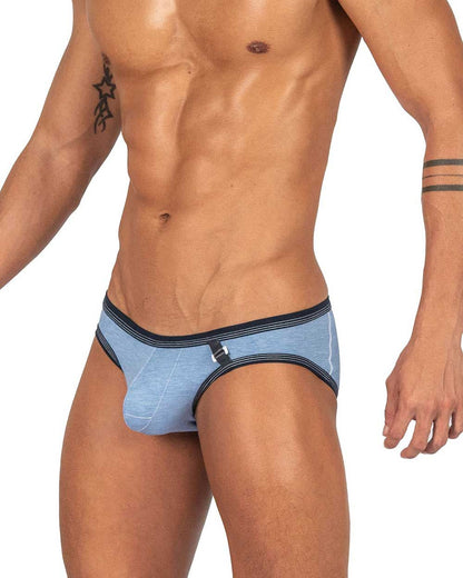 Light blue denim private structure barn boy low rise mini brief with dark navy trim and small metallic buckle detail