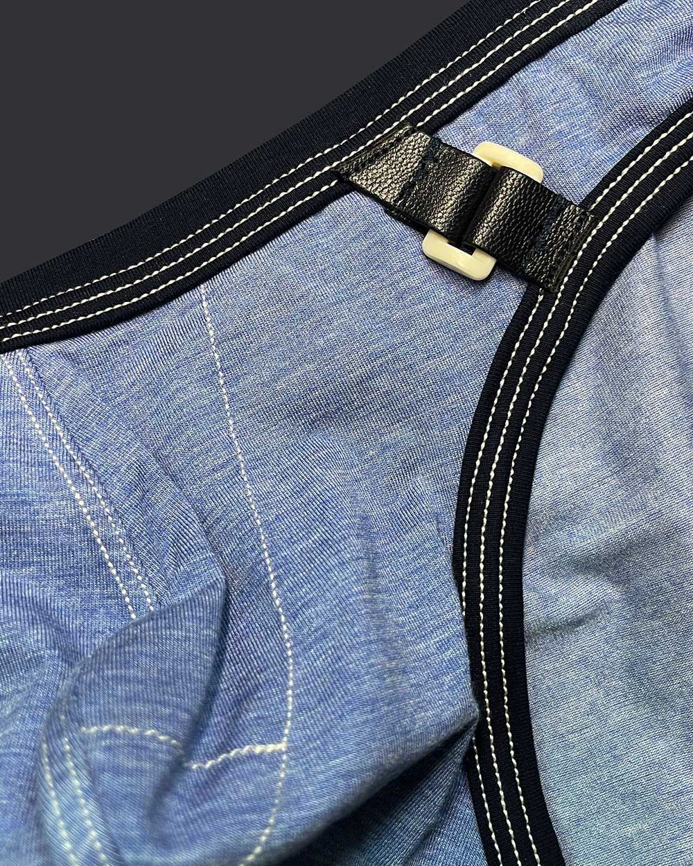 Private structure lcut4358 barn boy low rise mini brief denim with black leather strap and cream plastic buckle on blue denim