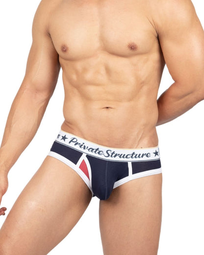 Navy blue and white men’s mid waist mini briefs with red triangle accent and private structure branded waistband