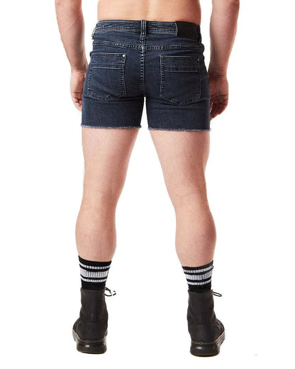 Back side of dark blue denim quad short with frayed hem and two pockets