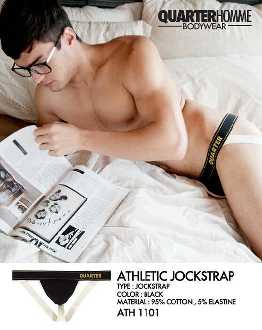 Black quarter homme athletic jockstrap with white trim and gold branding designed for performance and comfort size L