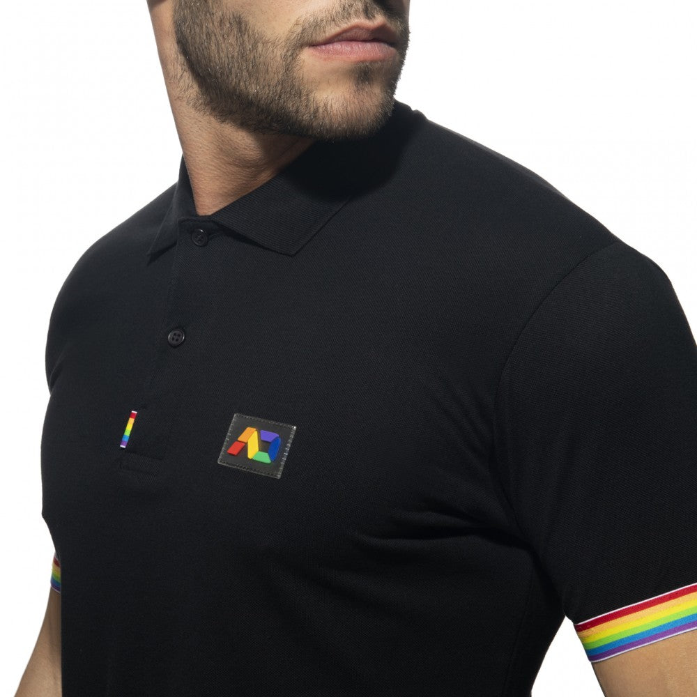Black polo shirt with rainbow trim on sleeve and matching rainbow logo patch on chest for casual wear
