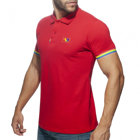 Red men’s cotton polo shirt with rainbow trim on sleeves and a small colorful logo patch on the chest