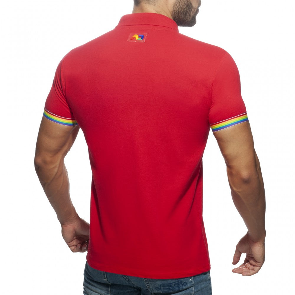 Red short-sleeved rainbow polo shirt with rainbow-striped cuffs and colorful logo on the collar